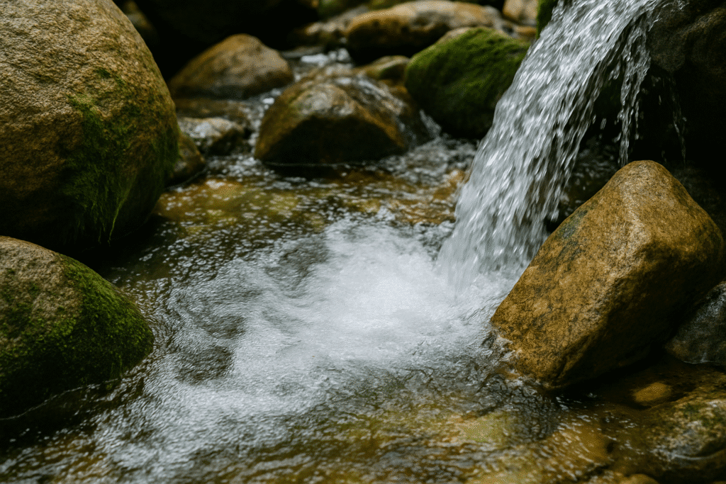 Flowing stream into mineral rich rocks.